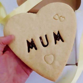 Giant biscuit with mum cut out