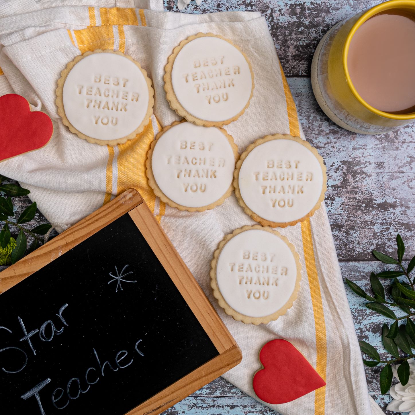 iced best teacher biscuits from bloom bakers