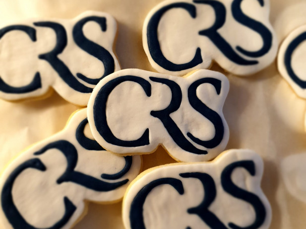 Bespoke hand iced biscuits for Charles Russell Speechlys by Bloom Bakers